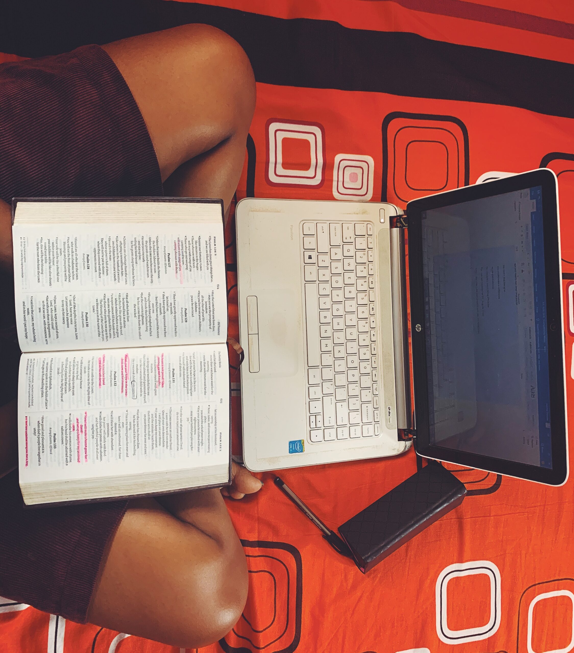 Iruoma with her bible and laptop showing the free bible study tools