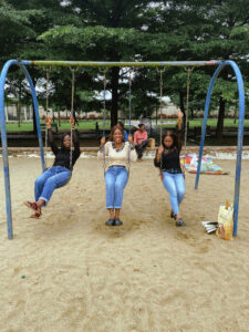 Iruoma and 2 friends on the swing at the ndubuisi kanu park