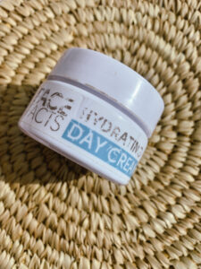 An image of the eco-friendly face facts hydrating day cream on a rattan mat