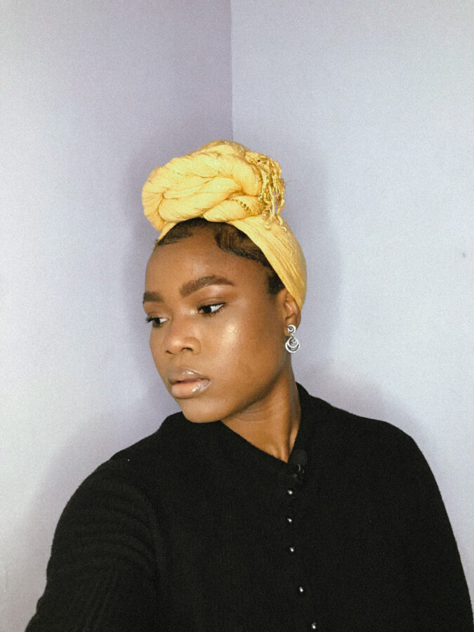 Uloma in a yellow turban and makeup