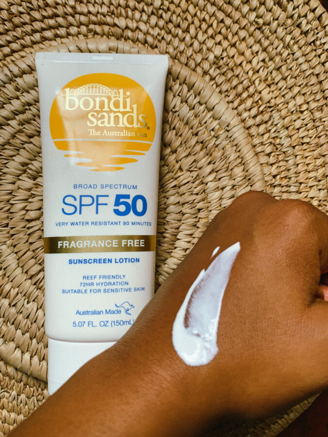 Blogger-Iruoma-showing-the-teture-of-the-bondi-sands-sunscreen