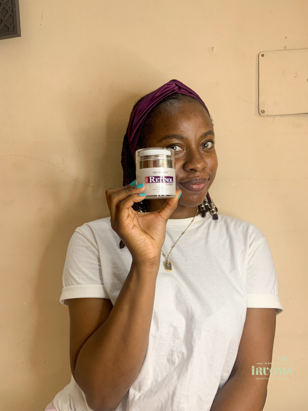 beauty-blogger-iruoma-holding-a-retinol-moisturiser